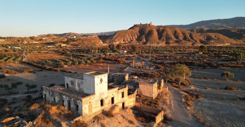 Drought-resistant - An aerial view of an old building in the desert