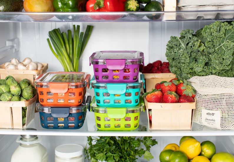 Refrigerator - green and pink plastic container