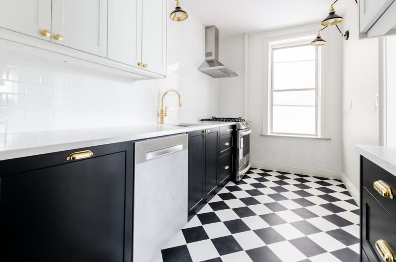 Dishwasher - white wooden door near white wooden kitchen cabinet