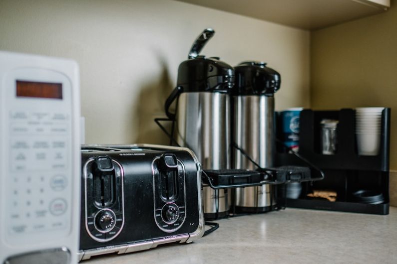 Kitchen Appliances - stainless steel bread toaster on brown wooden table